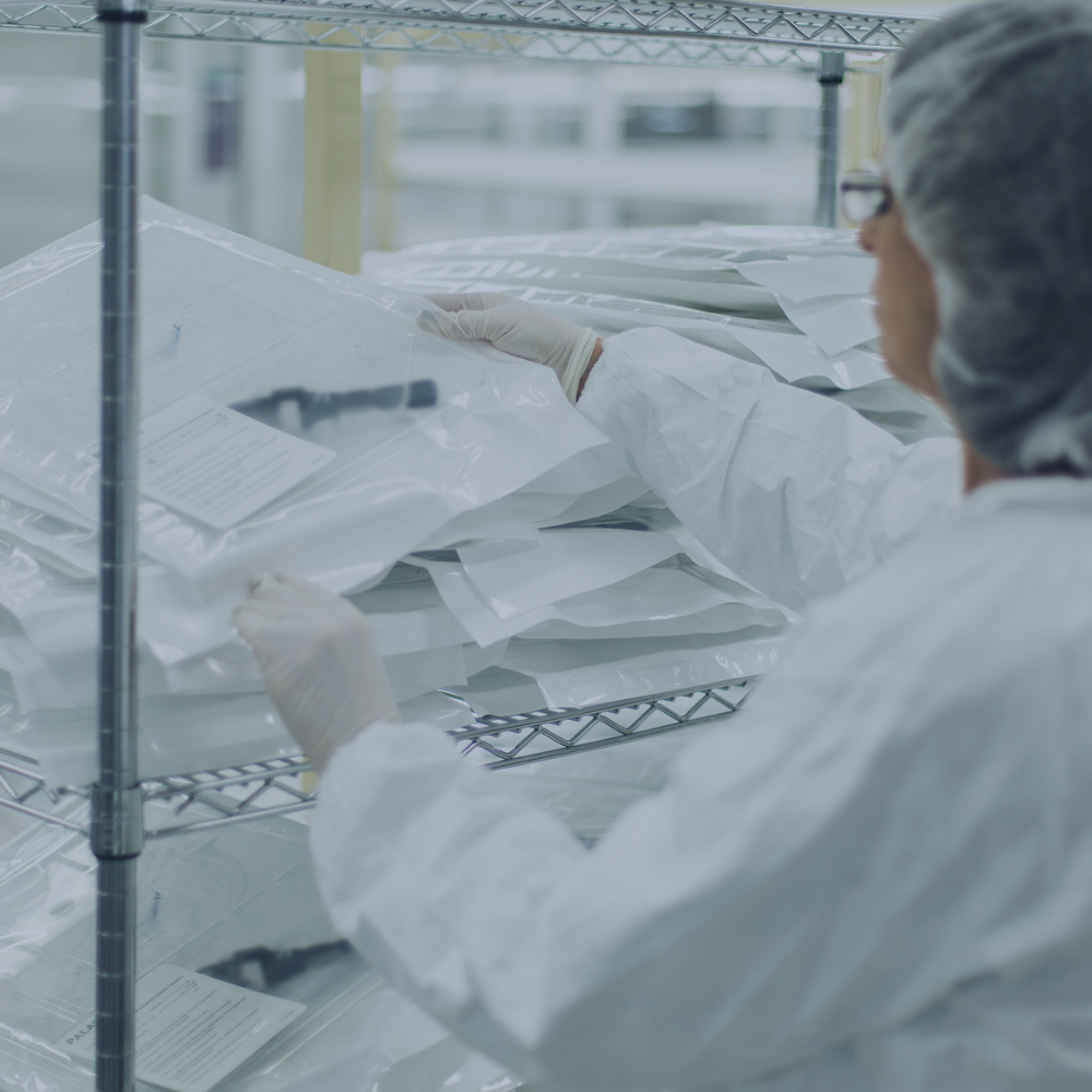 Technicians examining finished medical devices