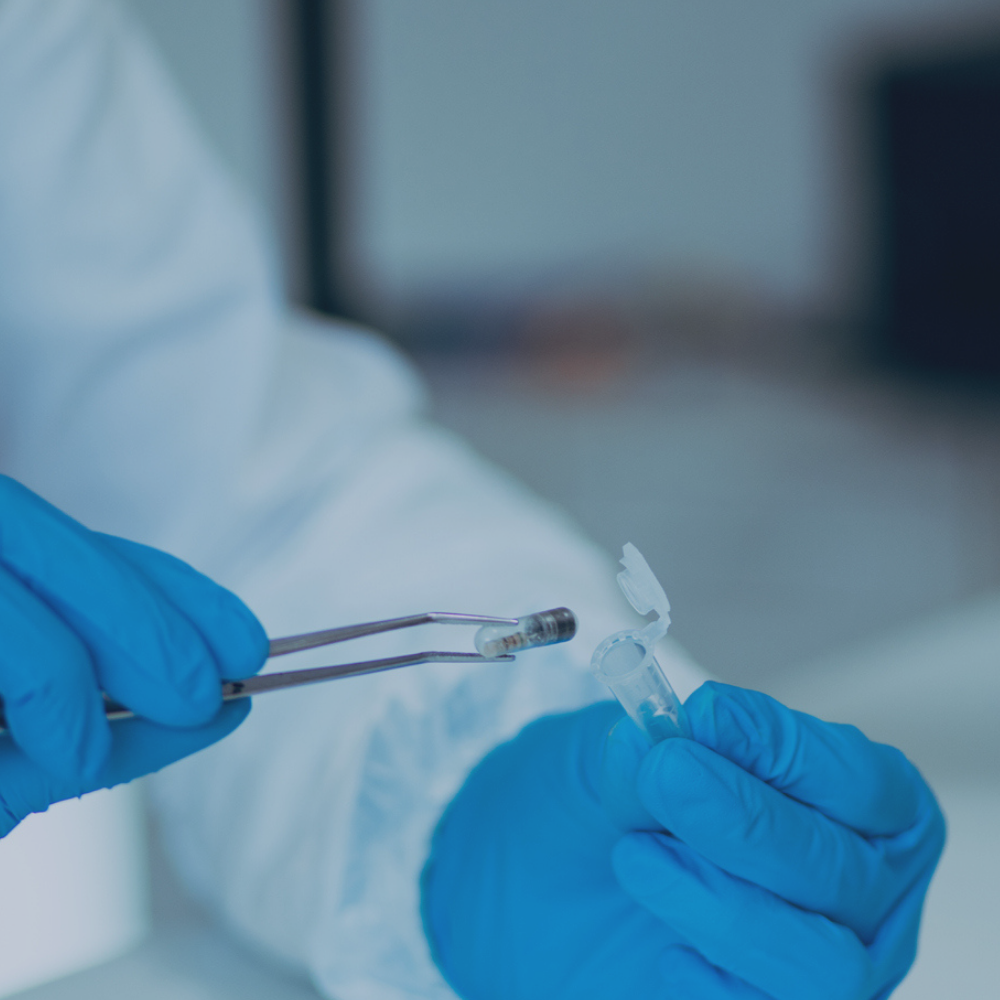 Lab technician adding sensor to medical device